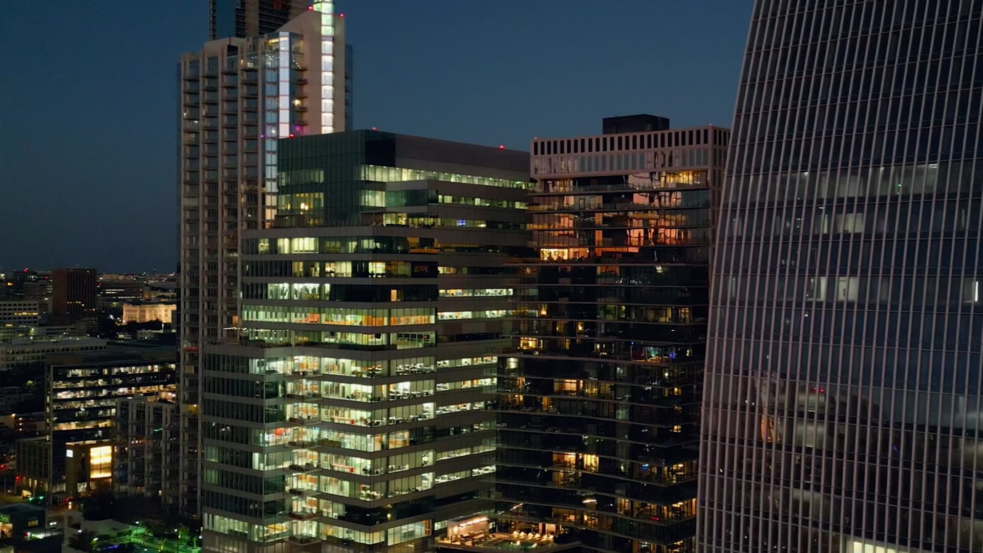 Illuminated office towers at dusk