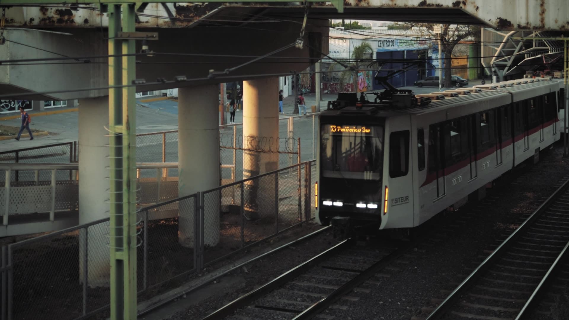 Train pulling into an elevated station platform